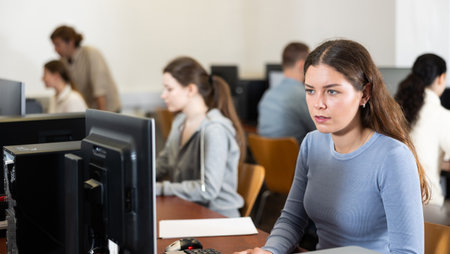Young woman working on computer in officeの写真素材