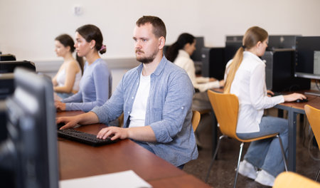 Young man working on computer in officeの写真素材