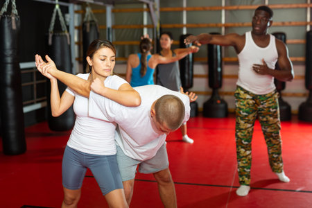 Men and women at group self-defense trainingの写真素材