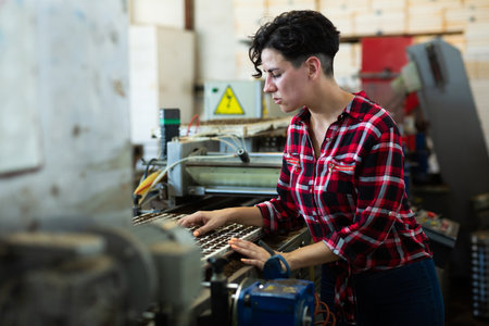 Woman working at conveyor in plant factoryの写真素材
