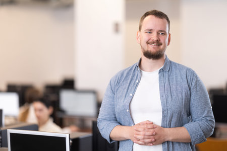 Man in computer design and information technology classroom