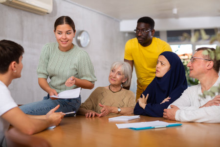 Group adult students different ages and multinational discussion during business courseの写真素材