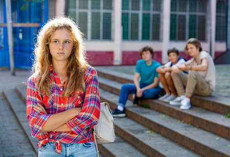 Sad girl quarreled with boysの写真素材