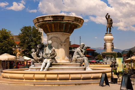 Central Skopje square with sculpted Olympia fountain in summerの写真素材