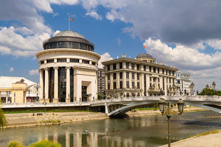 Government buildings and bridge over Vardar river in Skopjeの写真素材