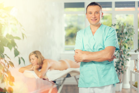 The skilled therapist presents massage proceduresの写真素材