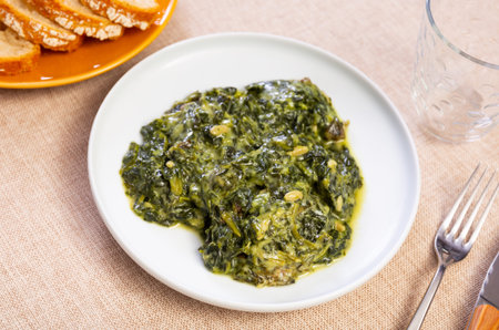 Spinach salad with raisins and pine nuts
