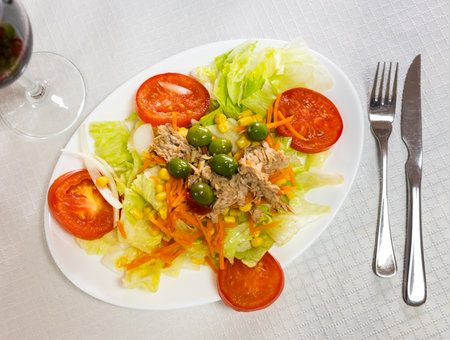Vitamin salad of fresh vegetables, china cabbage, olives, carrot and tuna filletの写真素材