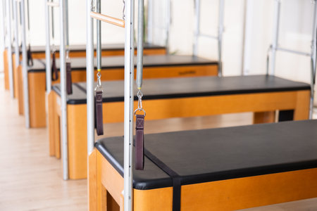 Reformer pilates studio machine for fitness workouts in sport gymの写真素材