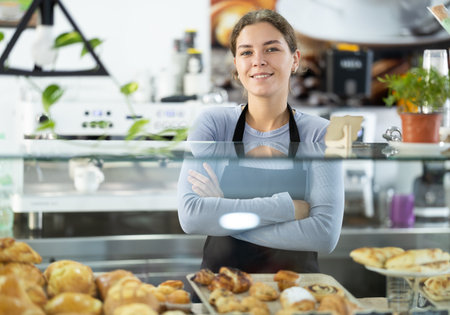 Friendly cafe employee invites you to visit establishmentの写真素材