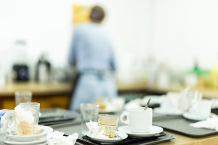 Dirty dishes in kitchen of restaurant or cafe