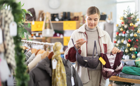 Adult woman chooses underwear in clothing store