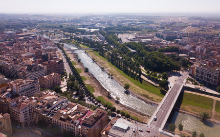 Aerial view of Lleida city with a apartment buildings and riverの写真素材
