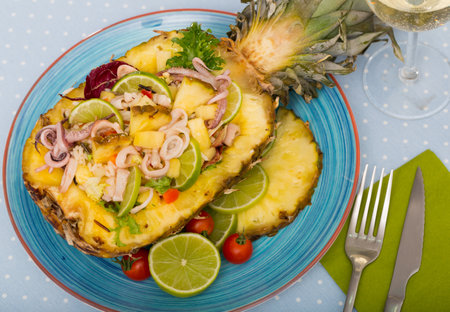 Salad with calamari, pineapple and limeの写真素材