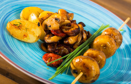 Assorted fried mushrooms with potatoesの写真素材