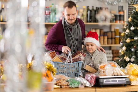 Man and his son buy sweetsの写真素材