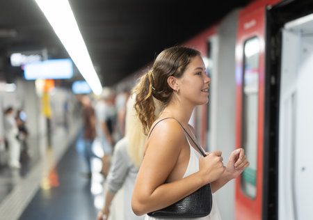 Young girl getting into metro wagonの写真素材