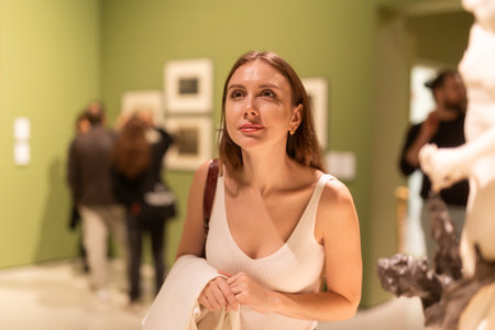 Girl view sculpture in museum hallの写真素材