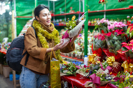Asian woman at christmas fairの写真素材