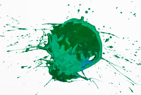Green paint spot on paper, colorfull artistic image on white backgroundの写真素材