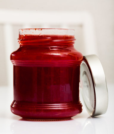 Glass jar of strawberry jam, closeupの写真素材