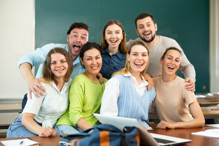 Portrait of happy group of adult students in classroomの写真素材