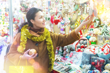 Woman purchasing christmas decorationsの写真素材