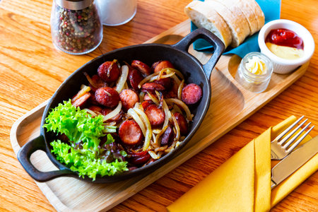 Grilled sausages with onionsの写真素材