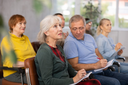 Adult students listening in classroom university