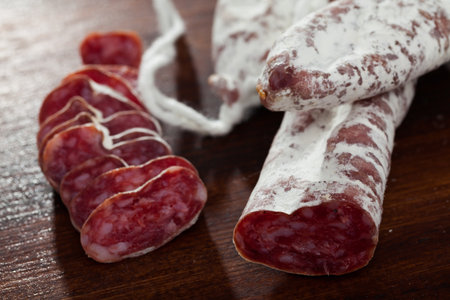 Slicing delicious Spanish smoked sausage fueteの写真素材