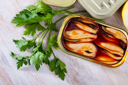 Pickled mussels in oil with parsley, lemon, spicesの写真素材