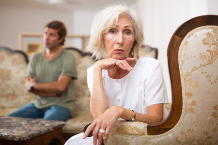 Sad family having difficulties in living room at homeの写真素材