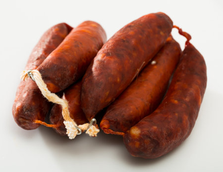 Sausages chorizo on white surfaceの写真素材