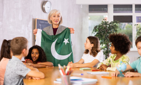 students listen to woman teacher who talks about Pakistanの写真素材