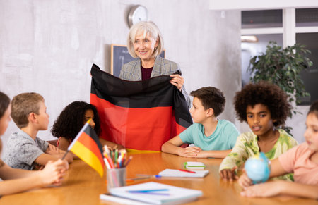 students listen to woman teacher who talks about Germanyの写真素材