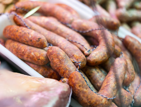 Sausages chorizo made of pork and chicken minced meat ready for grilling in meat shopの写真素材
