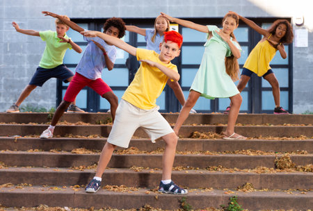 Group of kids performing street dance outdoorsの写真素材