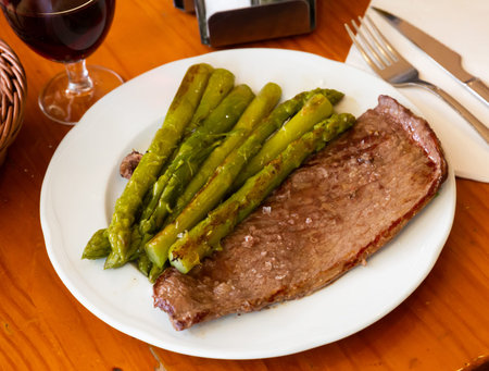 Prepared steak of beef with asparagus at plateの写真素材