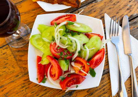 Salad with fresh tomatoes, cucumbers, onion and corianderの写真素材
