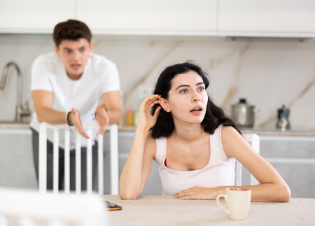Man quarrels with his wife and shouts at herの写真素材