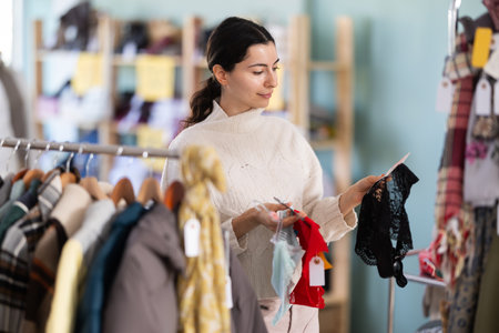 Regular customer woman chooses color and style of pantiesの写真素材