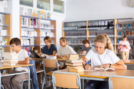 Fifteen-year-old girl writes out a synopsisの写真素材