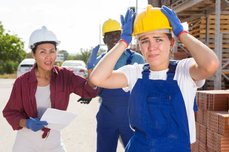 Workers have problems at work at a hardware storeの写真素材