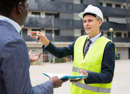 Architect transmits keys to the new african american businessman