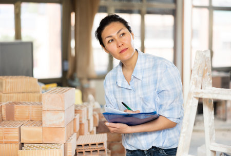 Asian woman makes important notes