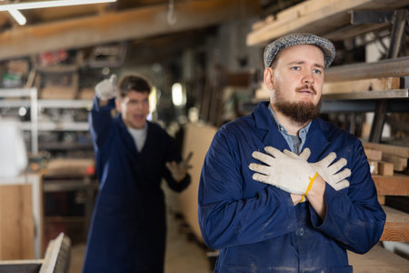 Young male carpenters in workshop