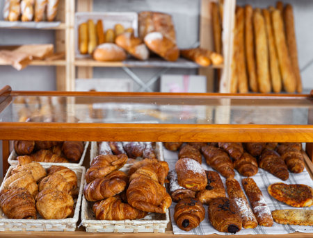 Warm bakery scene with fresh bread and pastriesの写真素材
