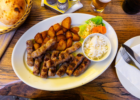 Grilled chevapcici sausages are made from minced meat mix