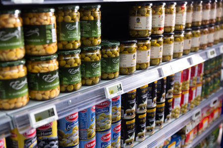 Canned goods with olives at groceries supermarketのeditorial素材