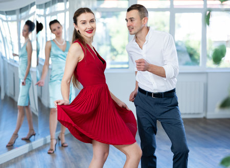 Couple in stage costumes learns boogie woogie dancing during individual lessonの写真素材